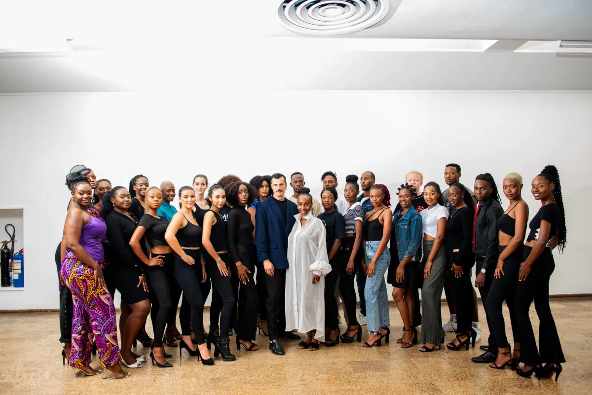 Group of models and organisers in a gallery hall
