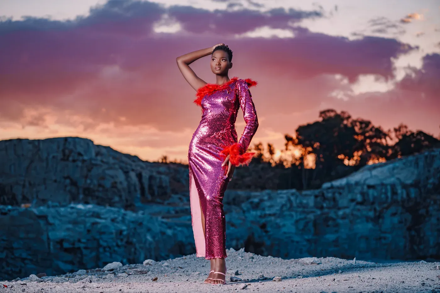 Model in a sequin dress at sunset